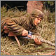 Soviet sniper woman at fire position