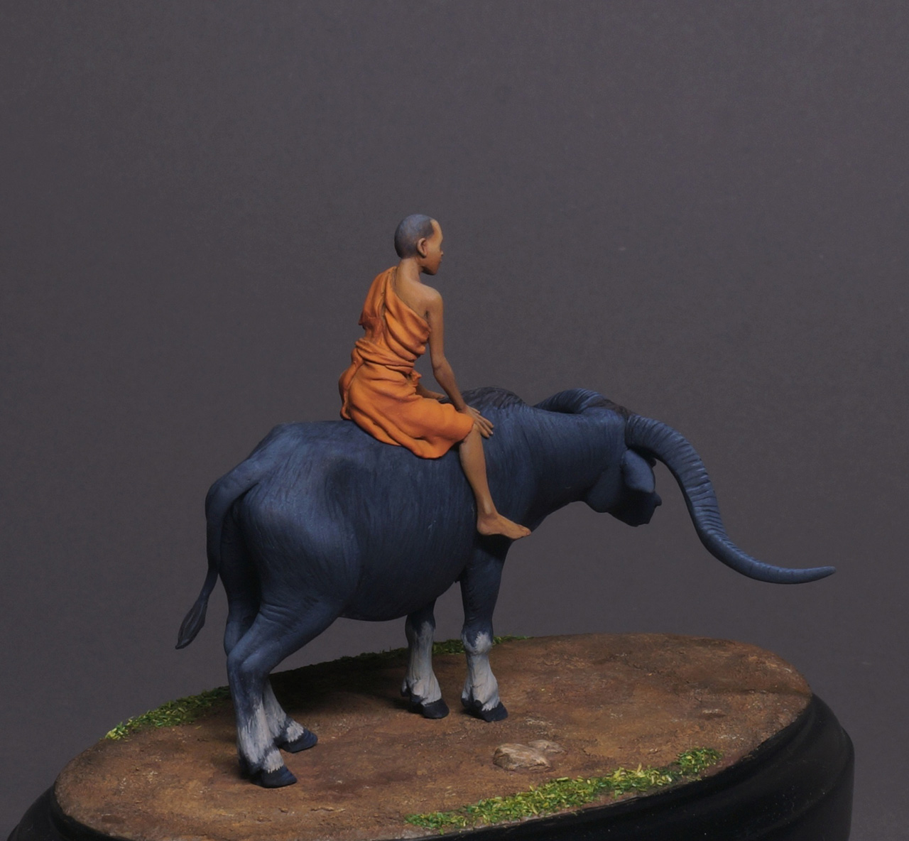 Figures: Boy on buffalo, photo #3