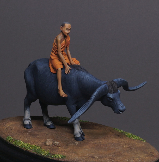 Figures: Boy on buffalo